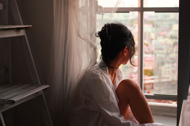 A young person looking out at the city